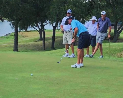 A team of funny players participating in a golf tournament on a golf course.