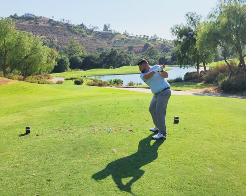 Left-Handed Golfer Hitting a ball.